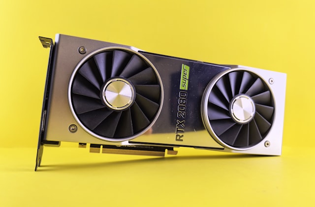 An NVIDIA GPU graphics card on a bright yellow background