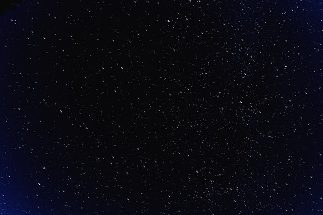 A star field at night: thousands of points, the nearest ones forming patterns